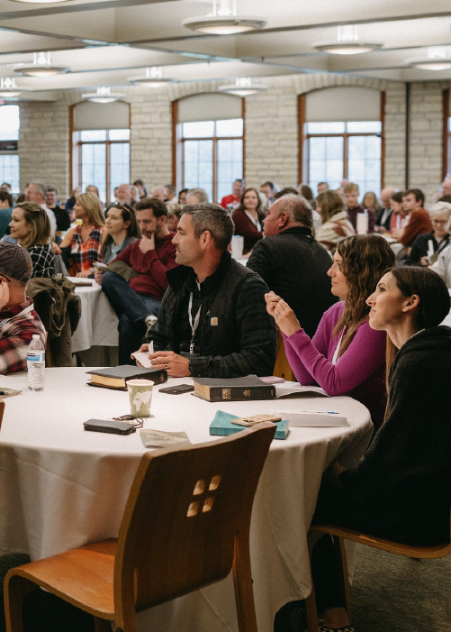 People listening at a conference