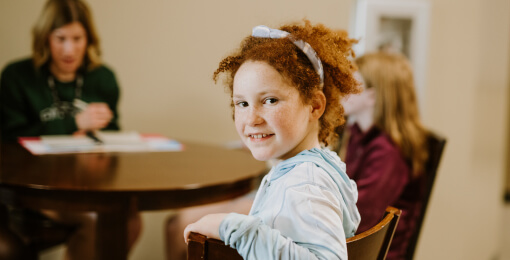 Girl smiling at Bible study