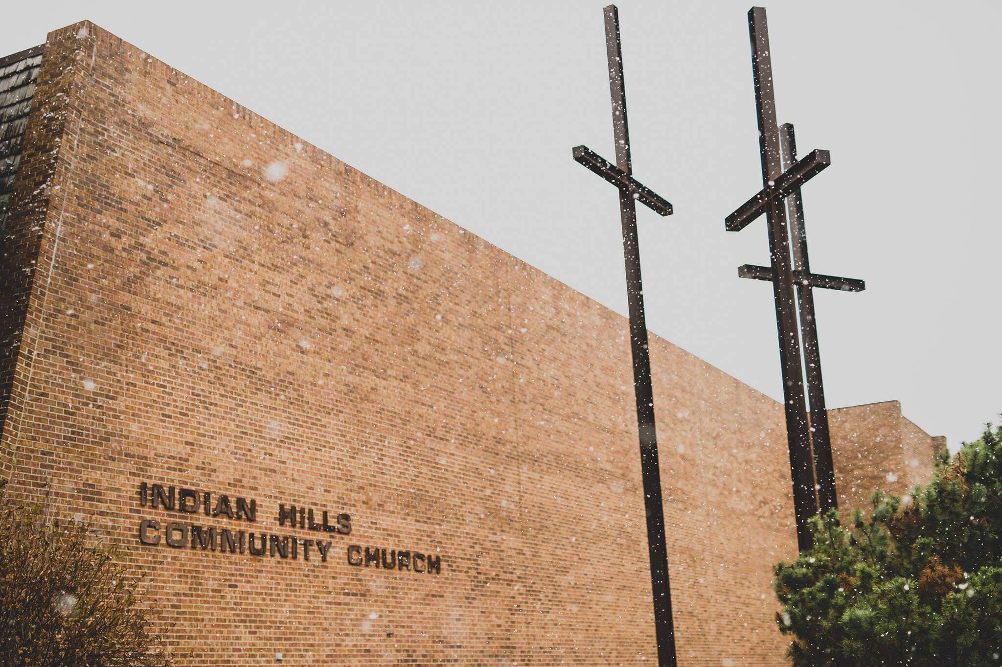 Snow falling outside a church