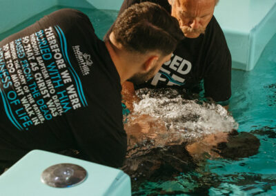 Mark Medina getting baptized