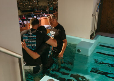 Men hugging after baptism