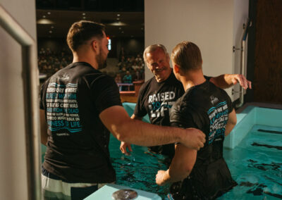 Kody Keller embraced after baptism