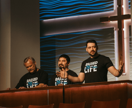 Pastor Mike preaching about baptism