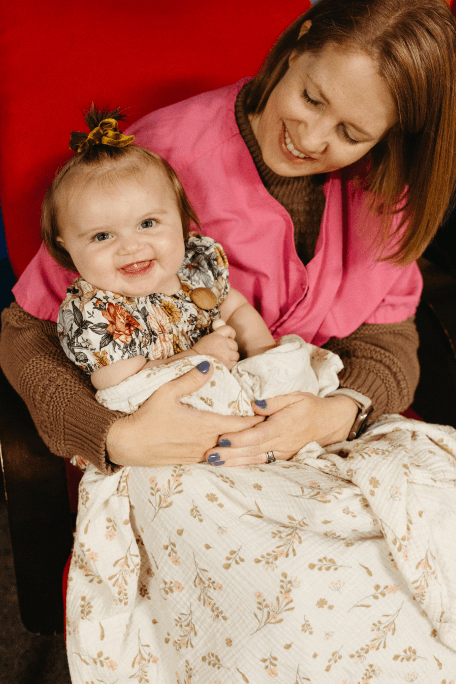 Woman holding baby at church
